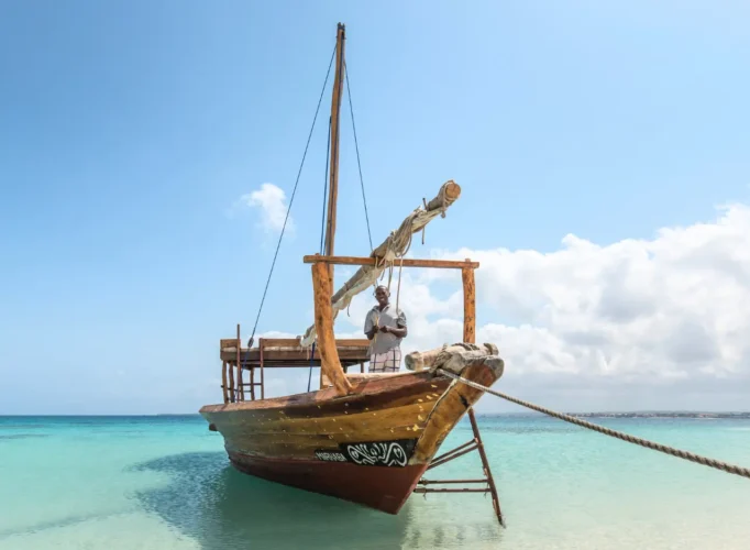 Handcrafted wooden boat floating near Zanzibar’s coastline