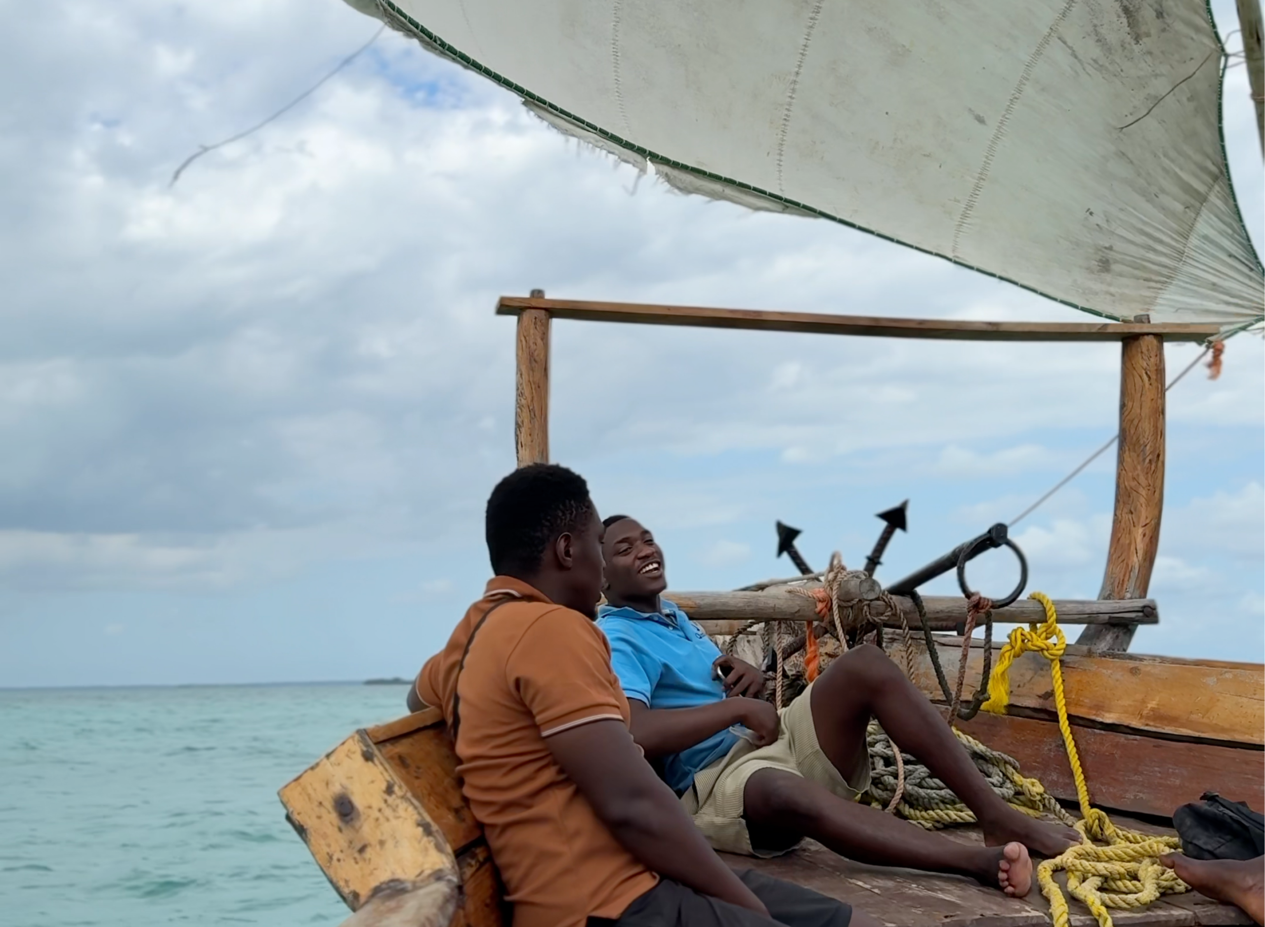 Ocean Blue crew relaxing on board a traditional dhow in Zanzibar