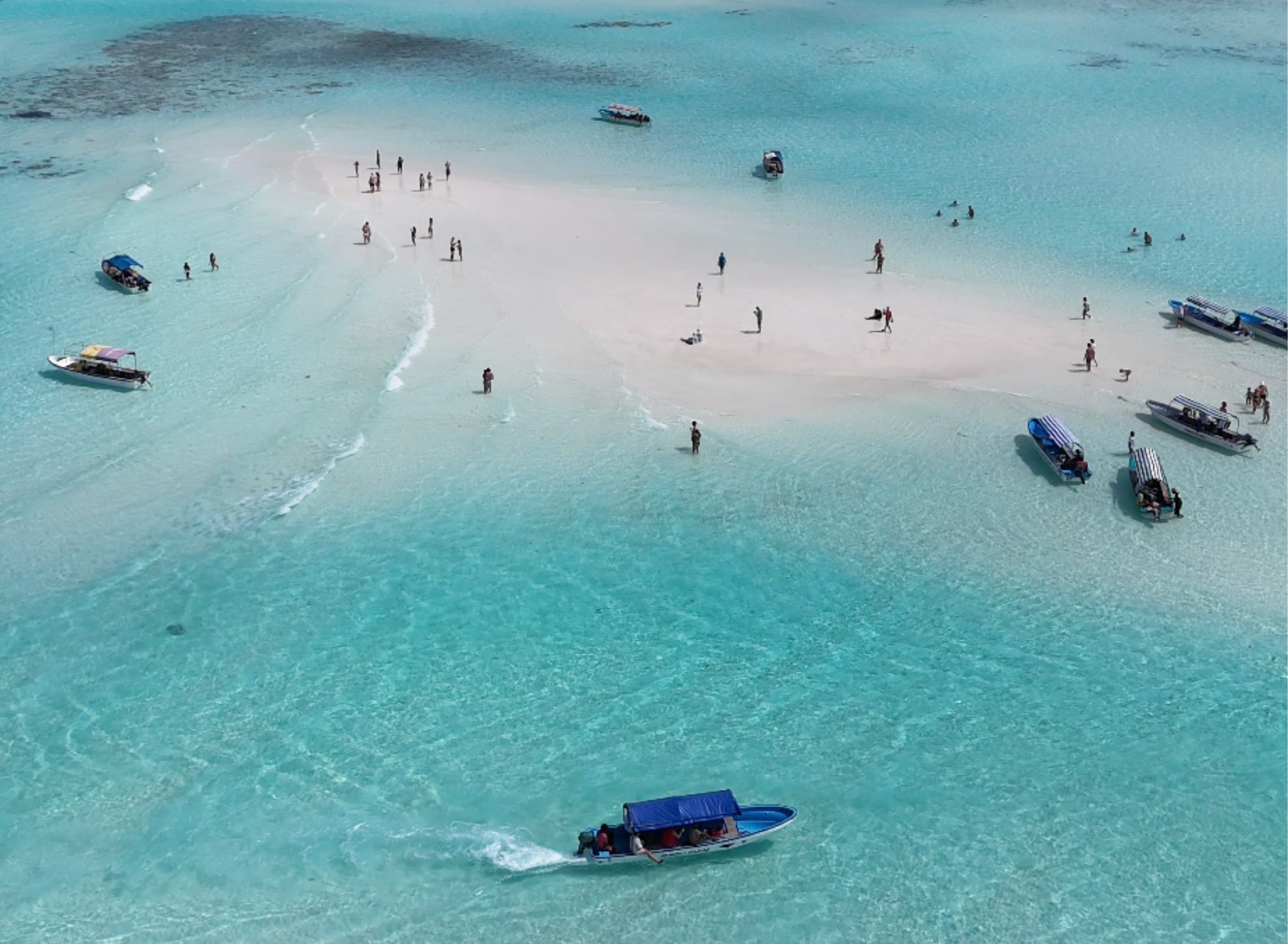 Aerial view of a sandbank with guests and boats near Mnemba, Zanzibar