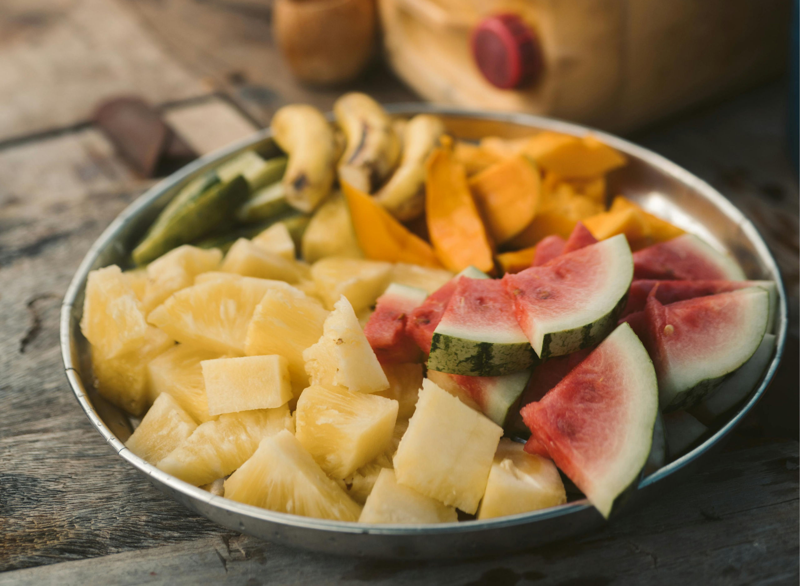 Bowl of fresh tropical fruit with watermelon, pineapple and mango